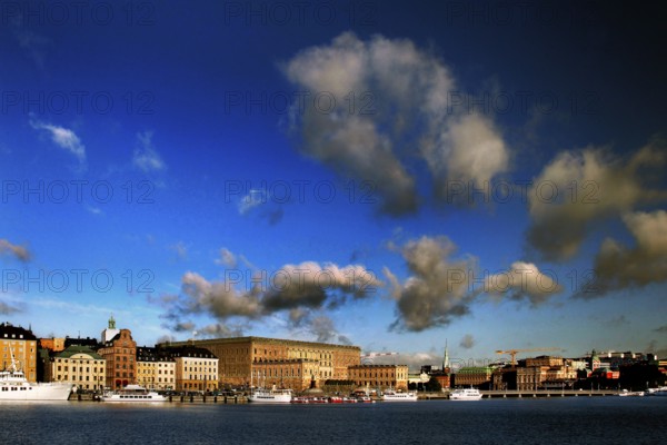 View of Stockholm harbor against an impressive blue sky with white clouds, Stockholm, Gamla Stan,