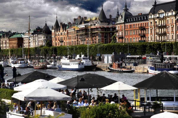 Lively waterfront area on Strandvägen with boats, cafés and impressive architecture, Stockholm,