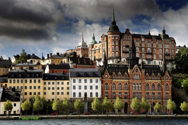 Historic buildings of Södermalm, Stockholm viewed in dramatic light from Riddarholmen, Stockholm,