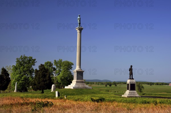 Several monuments stand in an open area of Gettysburg National Military Park, Gettysburg,