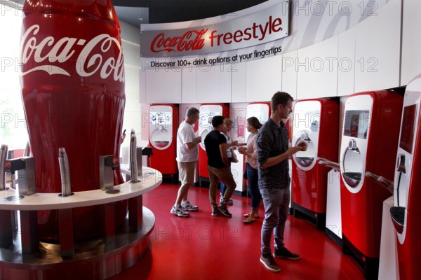 Visitors to the Coca-Cola Museum tasting room in Atlanta use the Coca-Cola Freestyle vending