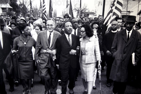 Martin Luther King Jr. leads a protest march with a large crowd, Atlanta, Georgia, USA