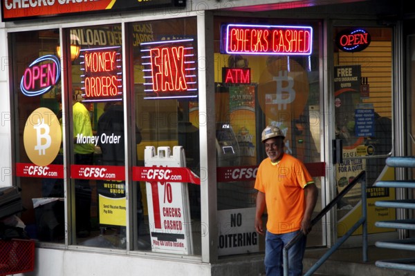A store in downtown Atlanta illuminated with eye-catching neon signs and a Bitcoin presence,