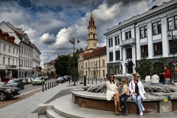 Bustling Town Hall Square, Rathausplatz, Rathausplatz in Vilnius with fountain and St. Nicholas