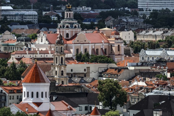 View of the old town of Vilnius with church towers and red roofs from the Three Crosses Hill,