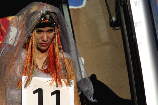 A woman in festive dress at the Miss Election during the Fête des Roses, El Kelâa m'Gouna,