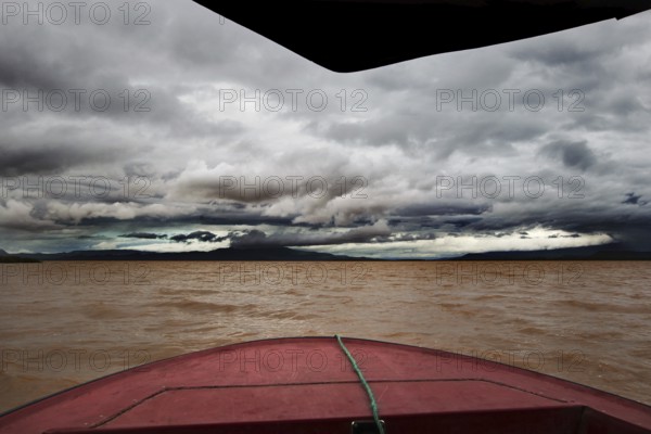 Threatening skies and gloomy waters on a boat trip across Lake Chamo, Nech Sar National Park,