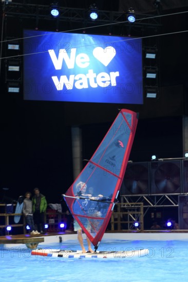 Press photo of wind surfer Windsurfer in the large XXL pool in Hall 17 of Messe Boot Düsseldorf, in