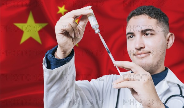 Doctor holding syringe on China flag background. Medical professional holding syringe with Chinese