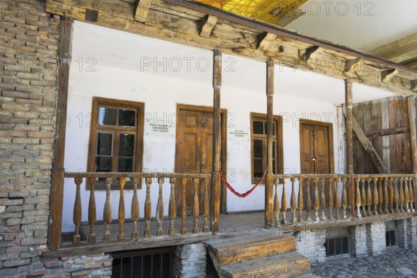 Rustic wooden veranda of a building with old wooden windows, birthplace of Josef Stalin, Gori,