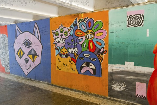 Colourful graffiti full of pop cultural elements and creative, surreal representations, underground