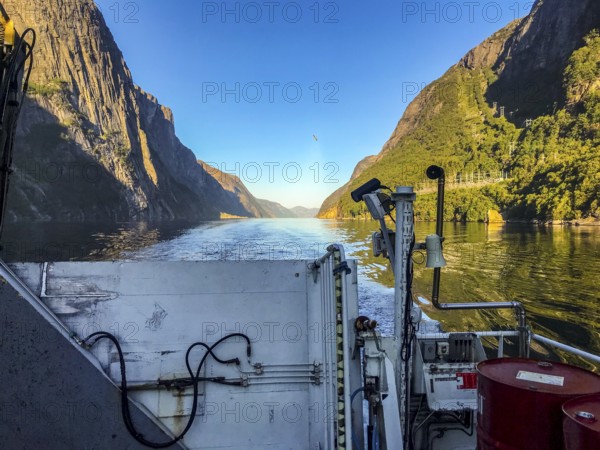 Lysebotn, Rogaland Municipality, Norway, View from a boat of the sunny Lysefjord surrounded by high
