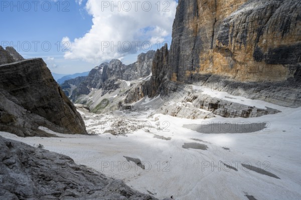 Spectacular mountain landscape with steep cliffs and remains of the Vedretta d'Ambiez glacier, Via