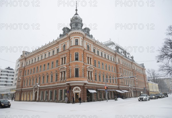 Historic building on the corner of Linnankatu Aurakatu, snowy roads, Turku or Swedish Åbo,