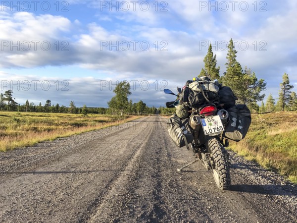 Idre, Dalarnas län, Sweden, BMW G 650 GS Sertao enduro motorcycle on a sunny road in the middle of