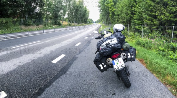 Broby, Skåne län, Sweden, BMW G 650 GS Sertao enduro motorcycle on wet roads with rainy atmosphere