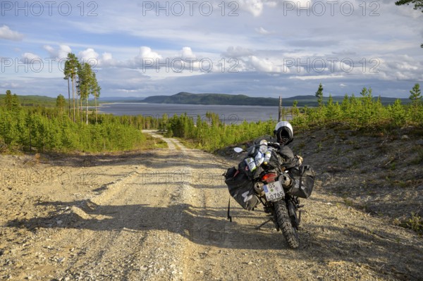 Lövdalen, Jämtland County, Sweden, BMW G 650 GS Sertao enduro motorcycle on a dirt road with views