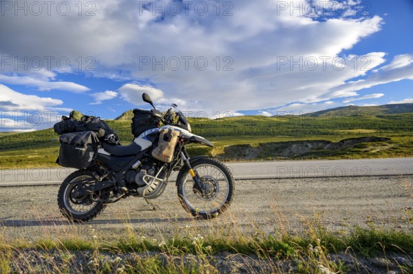 Dalholen, Innlandet, Norway, BMW G 650 GS Sertao enduro motorcycle on a quiet path in a wide hilly