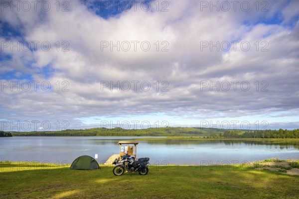 Rörström, Dorotea, Västerbotten, Sweden, picturesque seascape with tent and BMW G 650 GS Sertao