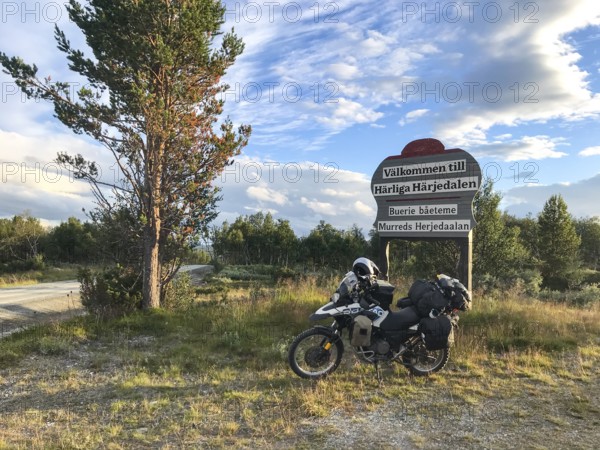 Funäsdalen, Jämtlands län, Sweden, Rural scene with a BMW G 650 GS Sertao Enduro motorcycle next to