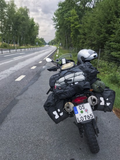 Broby, Skåne län, Sweden, BMW G 650 GS Sertao enduro motorcycle on a road with bags packed for a