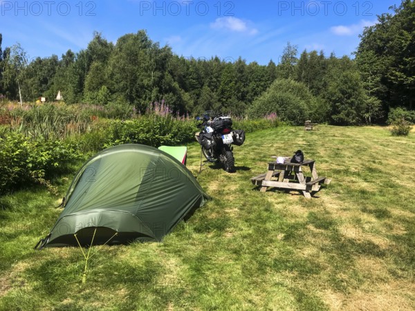 Växjö, Kronobergs län, Sweden, campsite with tent and BMW G 650 GS Sertao enduro motorcycle in a