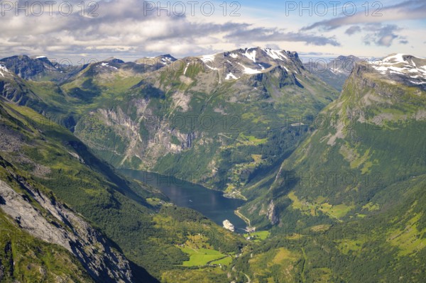 Geiranger, Møre og Romsdal province, Norway, view of the Geiranger fjord with a cruise ship nestled