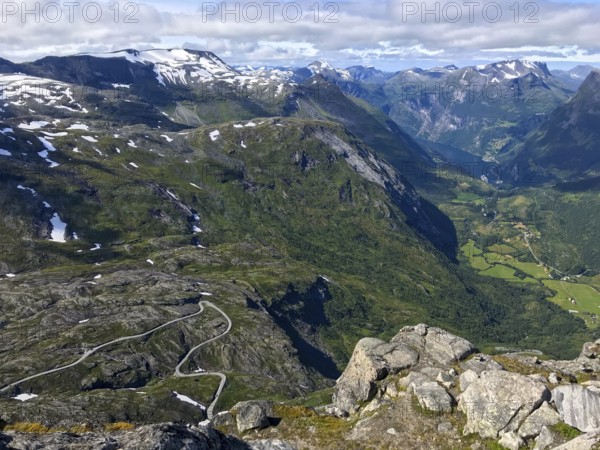 Geiranger, Møre og Romsdal province, Norway, view of a winding road in a deep, green mountain gorge