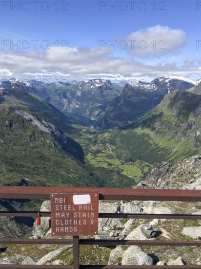 Geiranger, Møre og Romsdal Province, Norway, viewpoint with sign warning of hands or clothing