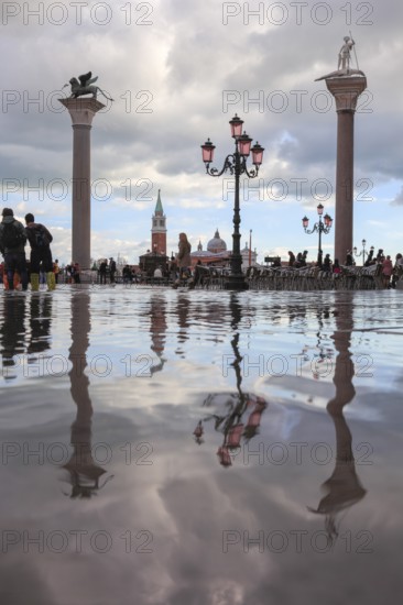 The pillars of Piazzetta, St. Mark and St. Theodorus, at high tide, Acqua Alta, San Marco, Venice,