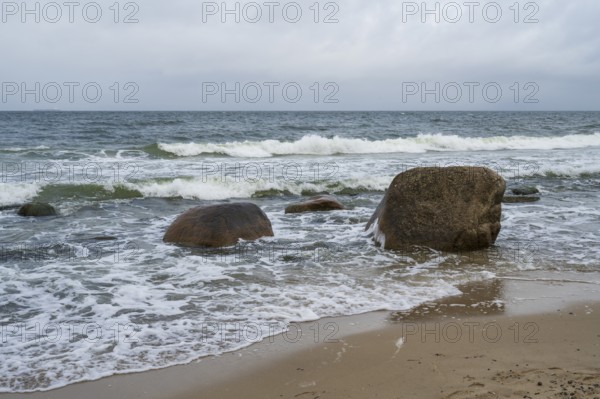 Boulders and waves on the coast, sandy beach, Baltic resort Göhren, Baltic Sea, Rügen island,