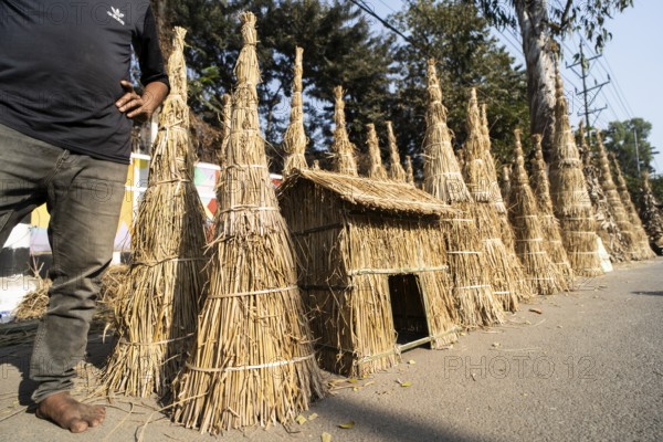 Vendor selling Meji (Bonfite), as part of preparations ahead of the 'Magh Bihu' festival, in