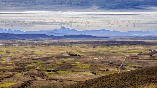 View over a wide plain with mountains in the distance, The Altiplano landscape in the Andes of