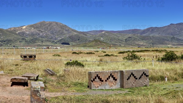 View of vast mountain landscape with stones and geometric patterns against a picturesque sky, The