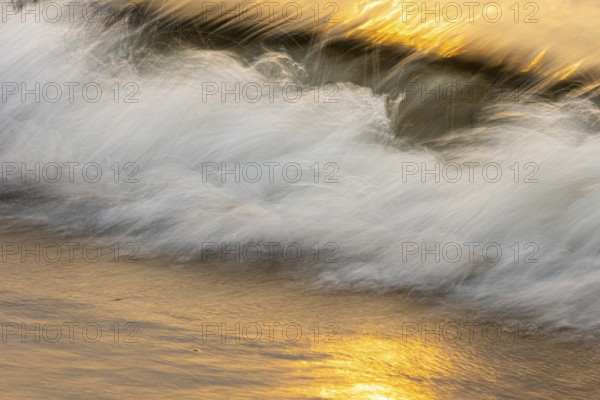 Waves at sunset on the west beach of Fischland-Darß-Zingst, Baltic Sea, Ahrenshoop,