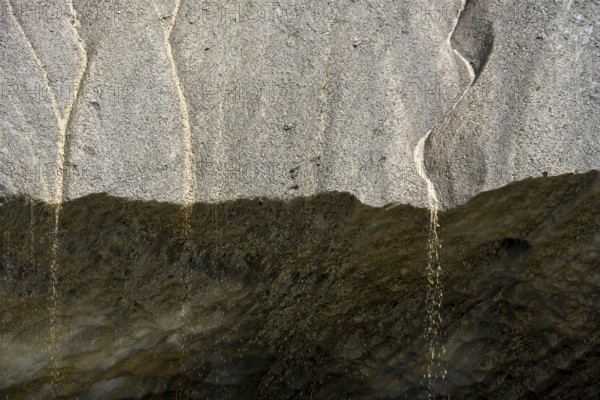 Meltwater at a glacier cave, underground glacier stream, Castner Glacier, Delta Range, Alaska