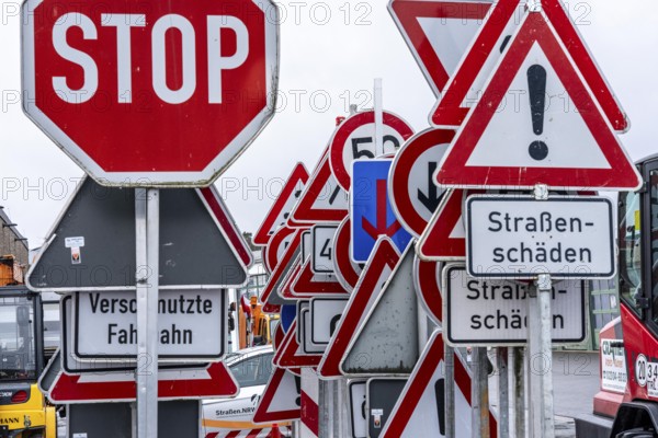 Storage for traffic signs in the yard of a road maintenance department, various signs with
