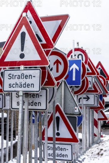Storage for traffic signs in the yard of a road maintenance department, various signs with