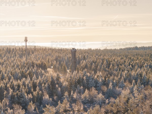 View of a winter forest with a tower and cell phone tower in the evening, Holohturm, Gernsbach,