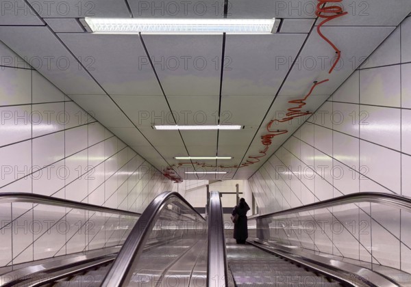Artwork titled Spur X by Enne Hähnle, escalators of the Kirchplatz subway station, Werhahm line,