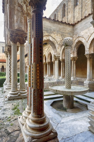Famous Benedictine monastery cloister, decorated columns, double columns and fountains, Monreale