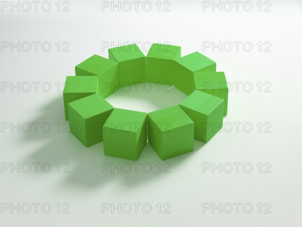 10 green wooden cubes against a white background