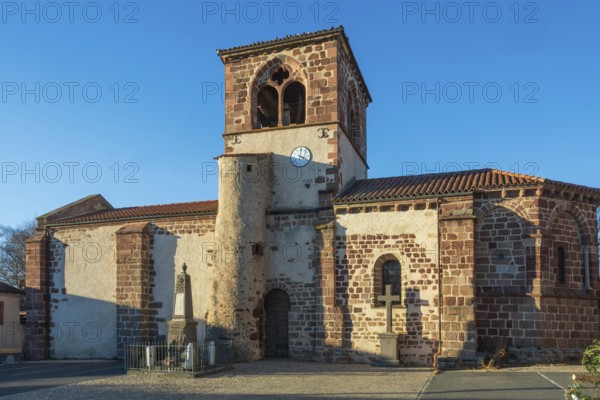 Azerat village. Roman church Saint-Jean-Baptiste . Haute Loire. Auvergne Rhone Alpes. France