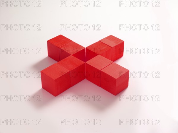 8 red wooden cubes against a white background
