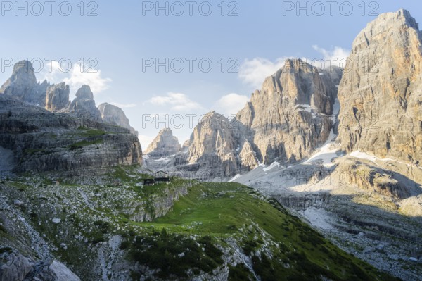 Picturesque mountain landscape in the morning, Rifugio Ai Brentei mountain hut and Cima Tosa rock