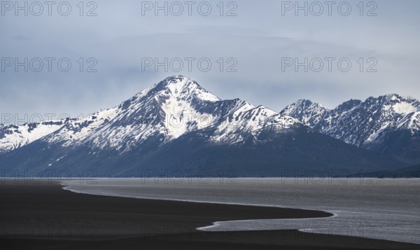 View of the Turnagain Arm estuary at low tide to the mountains of the Kenai Peninsula, Anchorage,