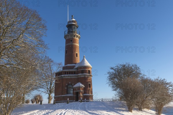 Holtenau lighthouse at the entrance of the Kiel Canal in winter, west bank of the Kiel Fjord,