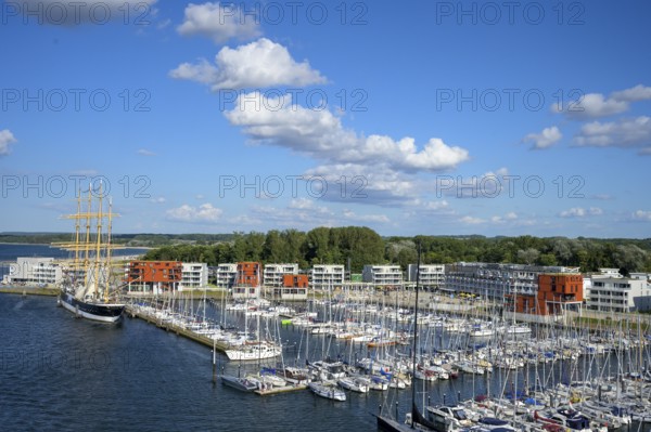 Harbour view with the legendary four-masted PASSAT barque and many boats in front of modern