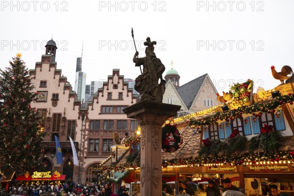 December 22, 2025, Frankfurt Christmas Market on Roemerberg at twilight. Traditional wooden stalls