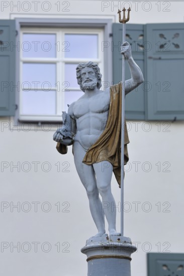 Fountain and Neptune with trident sculpture, Roman water god, Neptune fountain, market square,